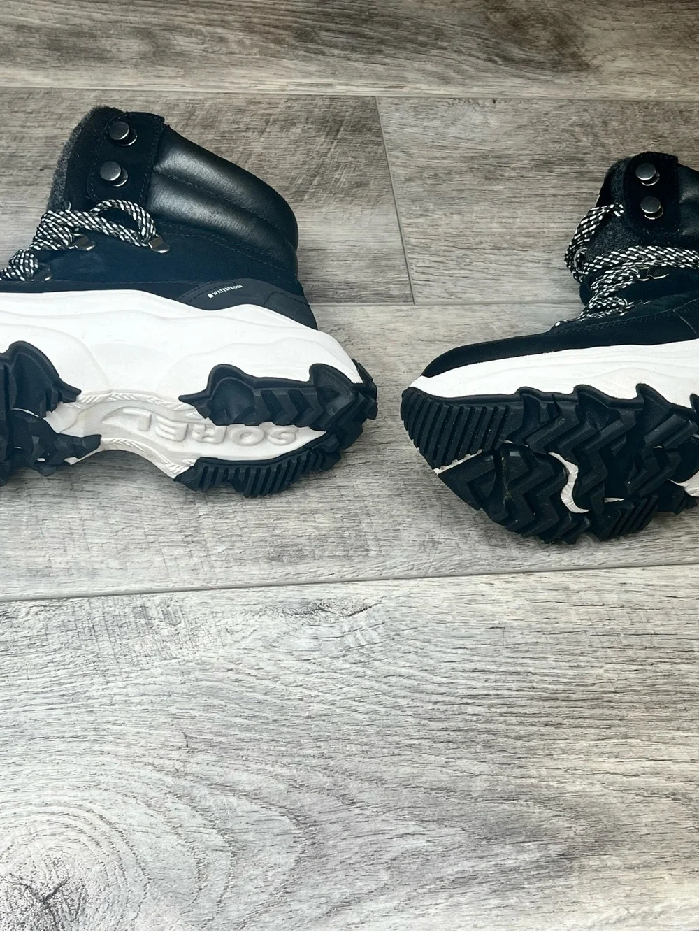 Sorel Black Lace-Up Winter Boots with White Accents